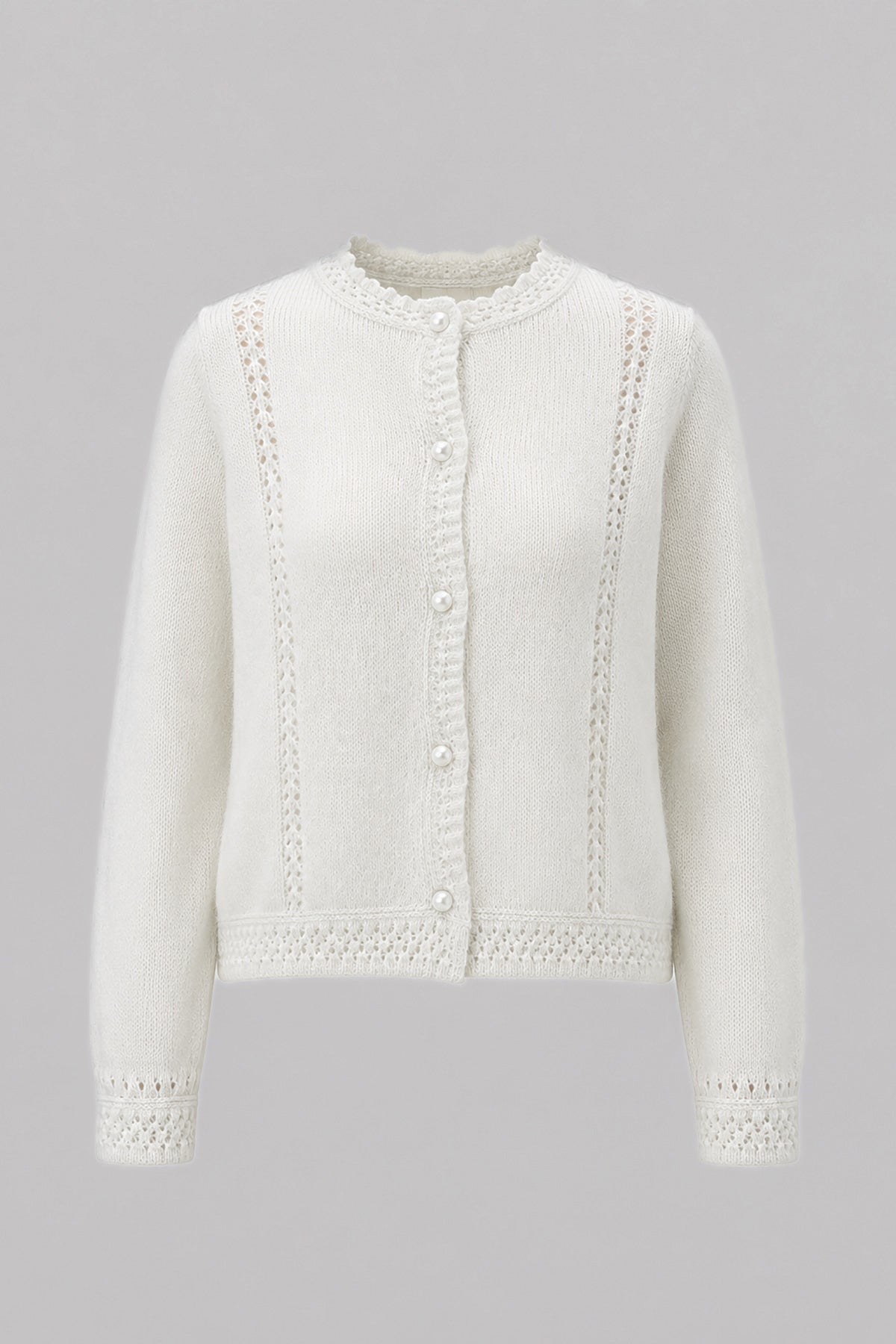 A delicate buttoned cardigan made of ecru alpaca wool and girl's wool.