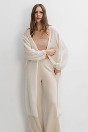 Long cardigan made of baby alpaca wool and ecru virgin wool.