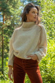 Knitted seamless oversized turtleneck sweater with roll-up cuffs, made of kid mohair and merino wool, beige
