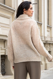 Knitted seamless oversized turtleneck sweater with roll-up cuffs, made of kid mohair and merino wool, beige