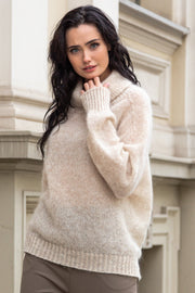Knitted seamless oversized turtleneck sweater with roll-up cuffs, made of kid mohair and merino wool, beige