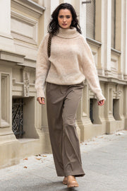 Knitted seamless oversized turtleneck sweater with roll-up cuffs, made of kid mohair and merino wool, beige