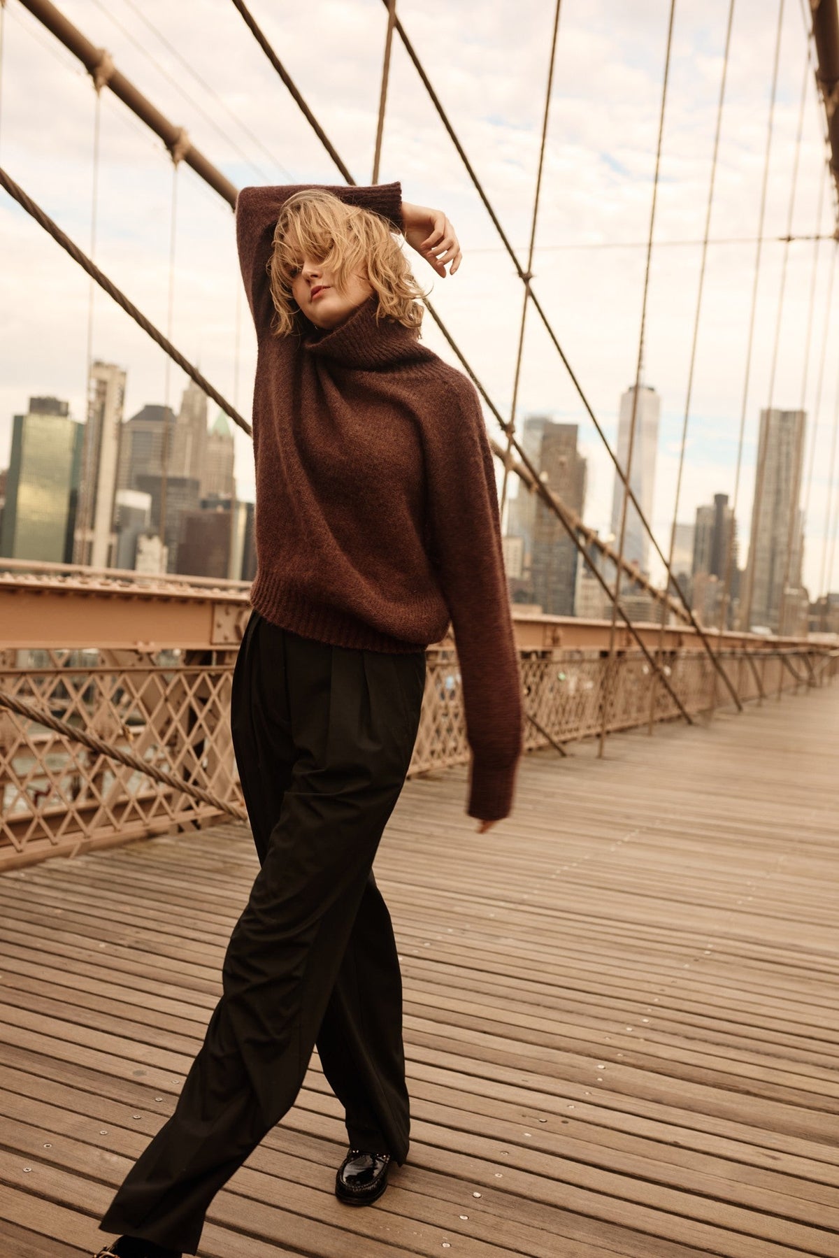 Knitted seamless oversized turtleneck sweater with roll-up cuffs, made of kid mohair and merino wool, brown