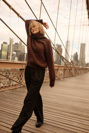 Knitted seamless oversized turtleneck sweater with roll-up cuffs, made of kid mohair and merino wool, brown