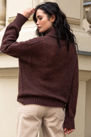 Knitted seamless oversized turtleneck sweater with roll-up cuffs, made of kid mohair and merino wool, brown