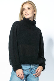 KID MOHAIR AND MERINOS WOOL SEAMLESS OVERSIZED TURTLENECK SWEATER WITH CUFFED CUFFS, BLACK