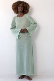 Long openwork dress with a neckline on the back made of pistachio cotton