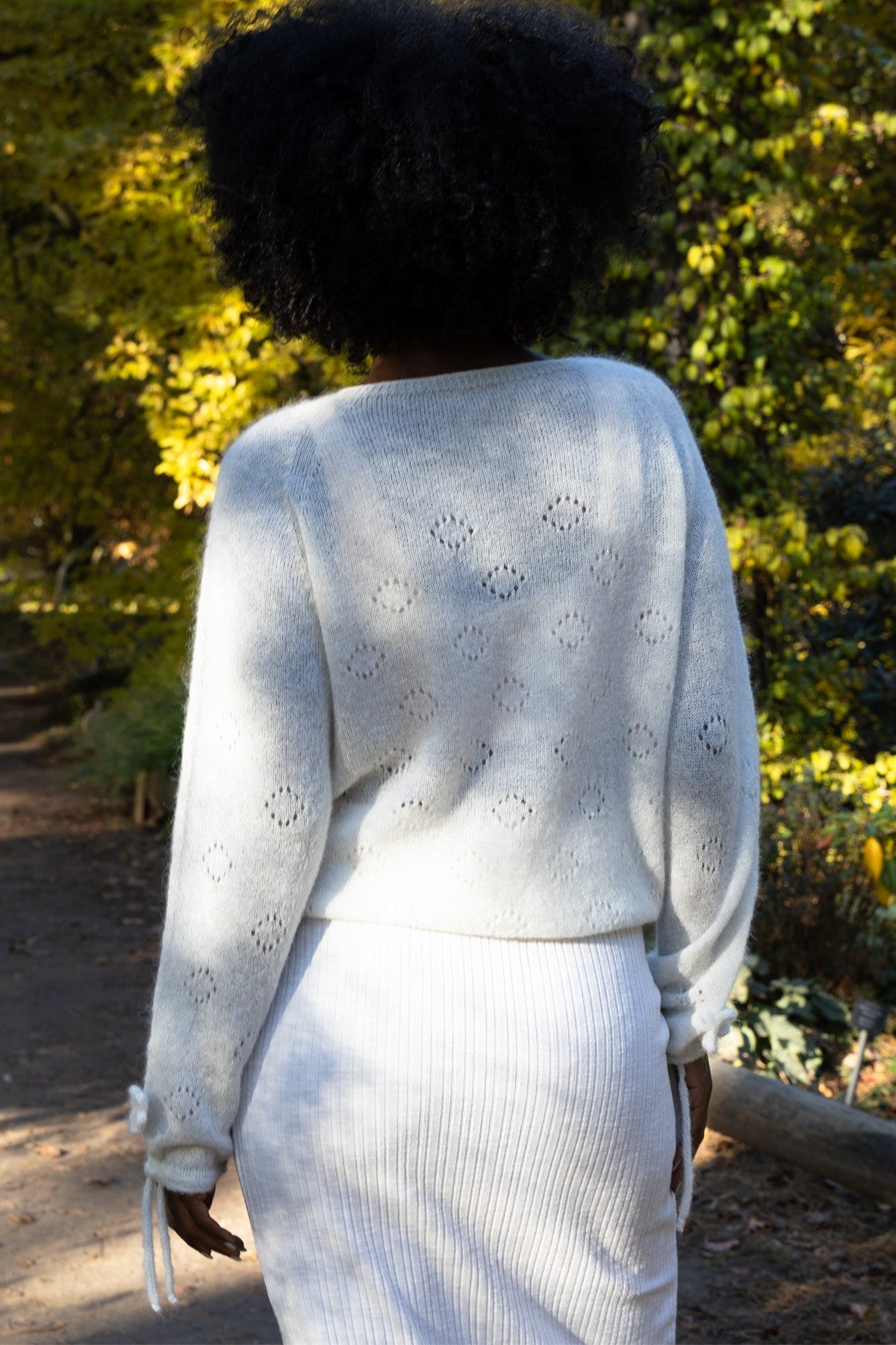 Elegant ecru hand-decorated suri wool sweater