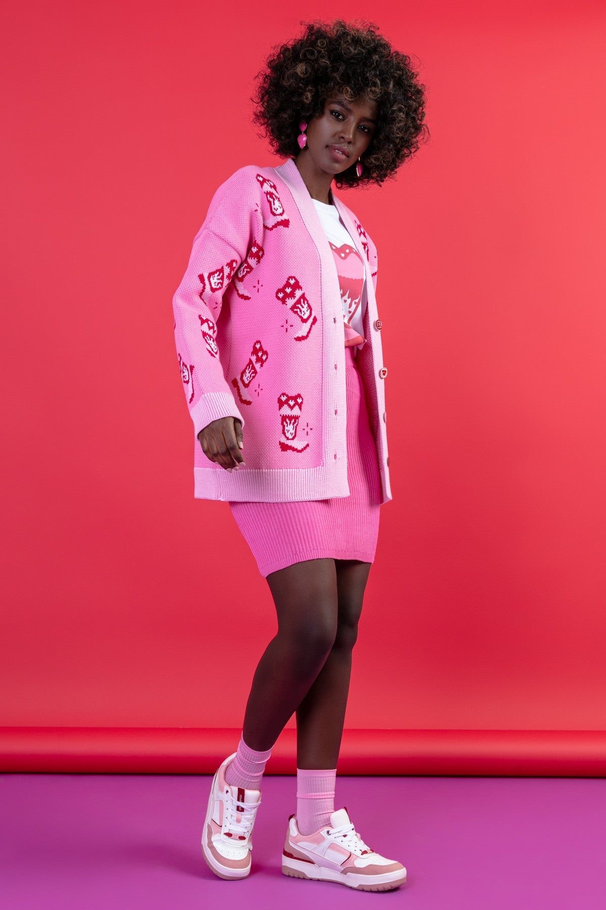 Jacquard cardigan with a cowboy boot pattern in sweet pink