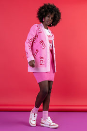 Jacquard cardigan with a cowboy boot pattern in sweet pink