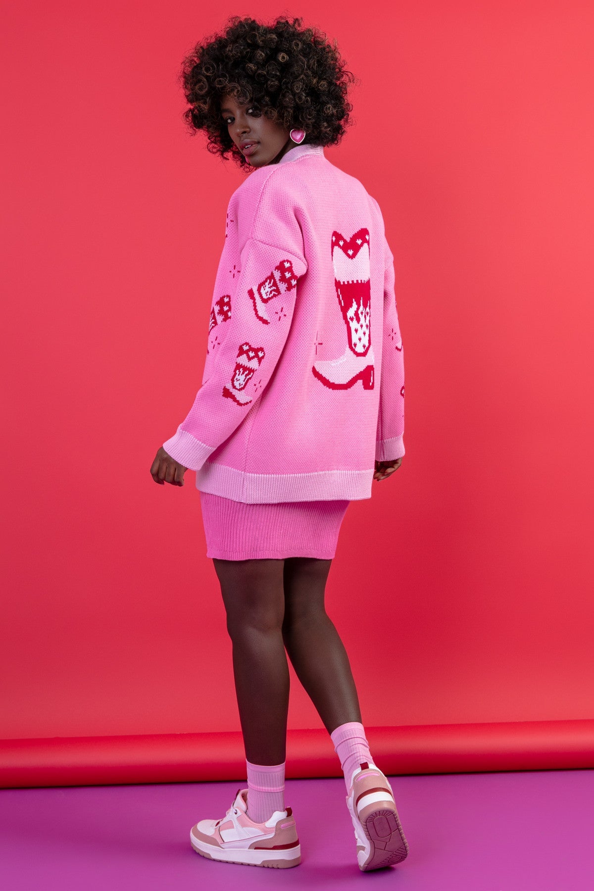 Jacquard cardigan with a cowboy boot pattern in sweet pink