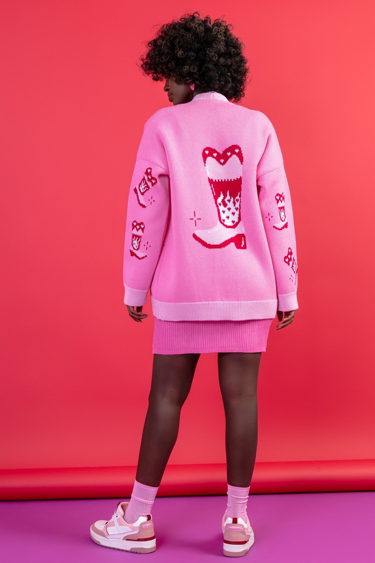 Jacquard cardigan with a cowboy boot pattern in sweet pink
