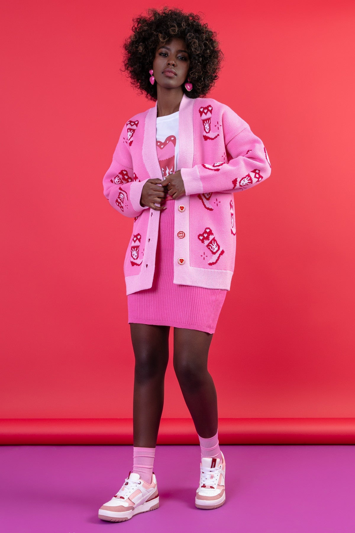 Jacquard cardigan with a cowboy boot pattern in sweet pink