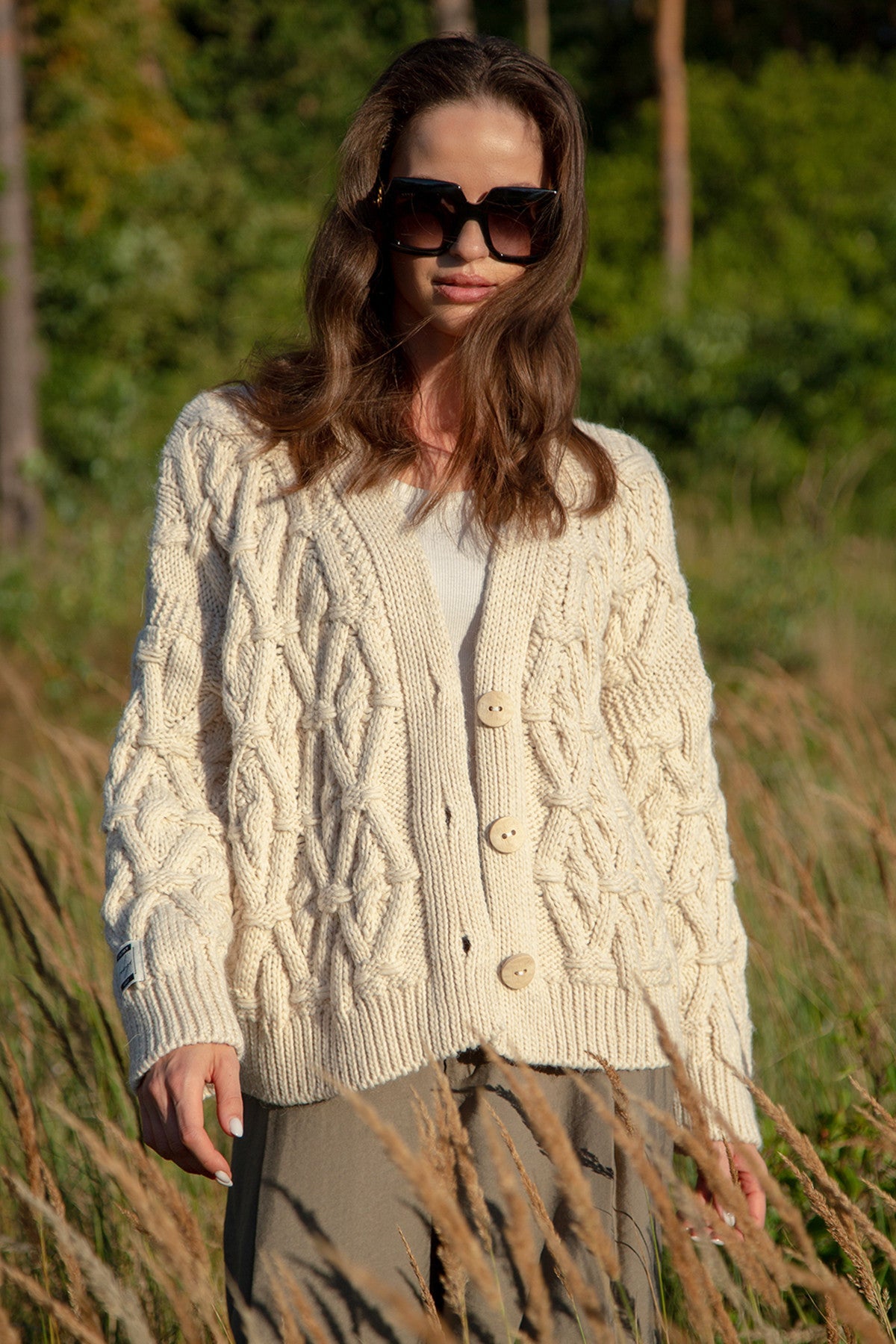 Classic buttoned cardigan with aran weave, beige
