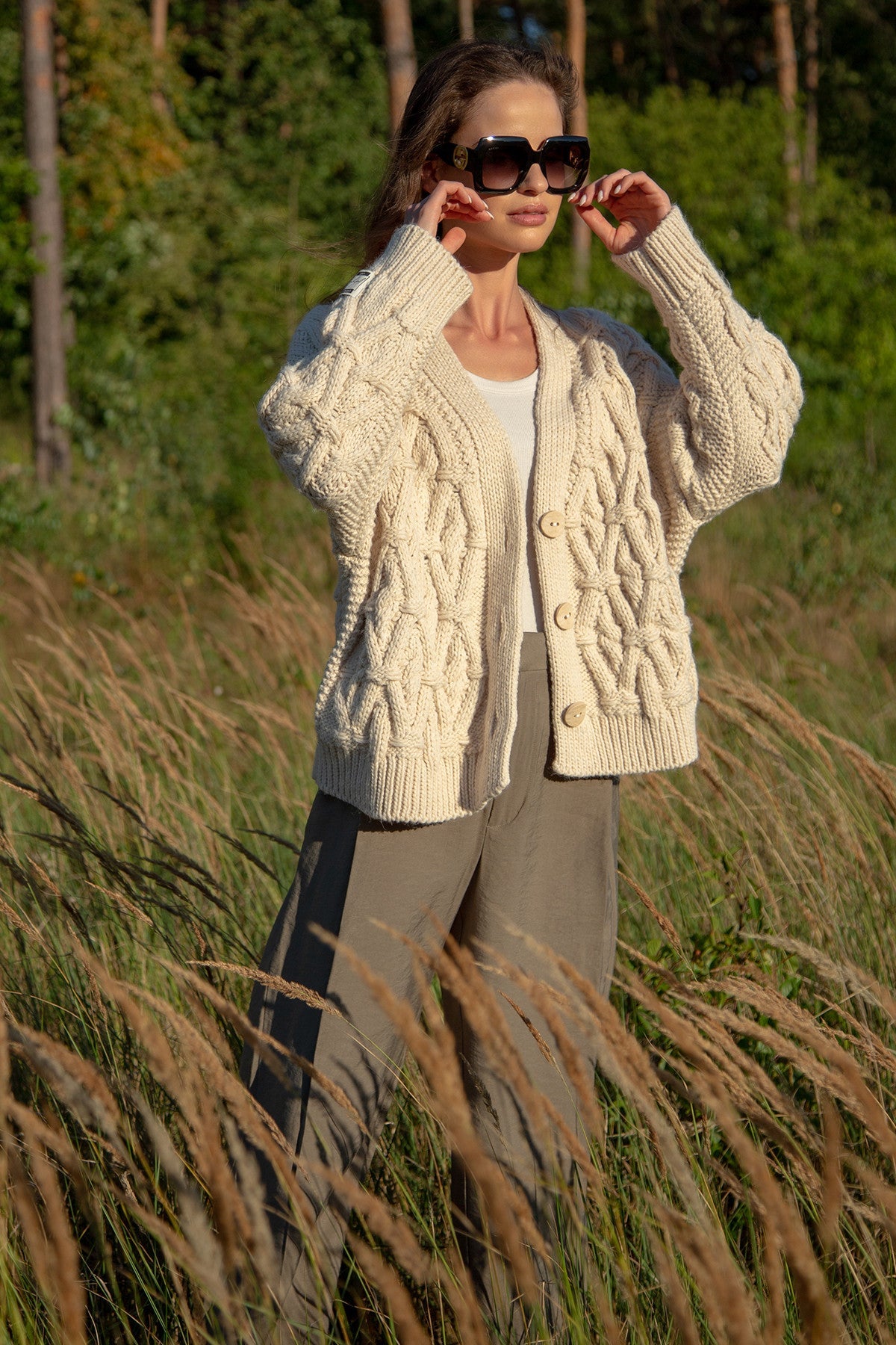 Classic buttoned cardigan with aran weave, beige
