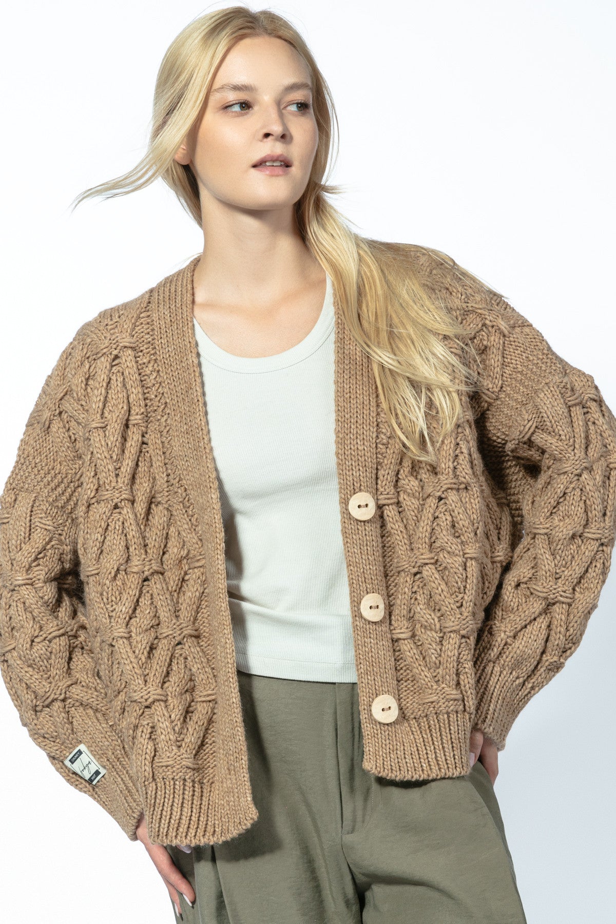Classic buttoned cardigan with a caramel aran weave