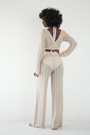 Set of long openwork trousers and a tied beige blouse