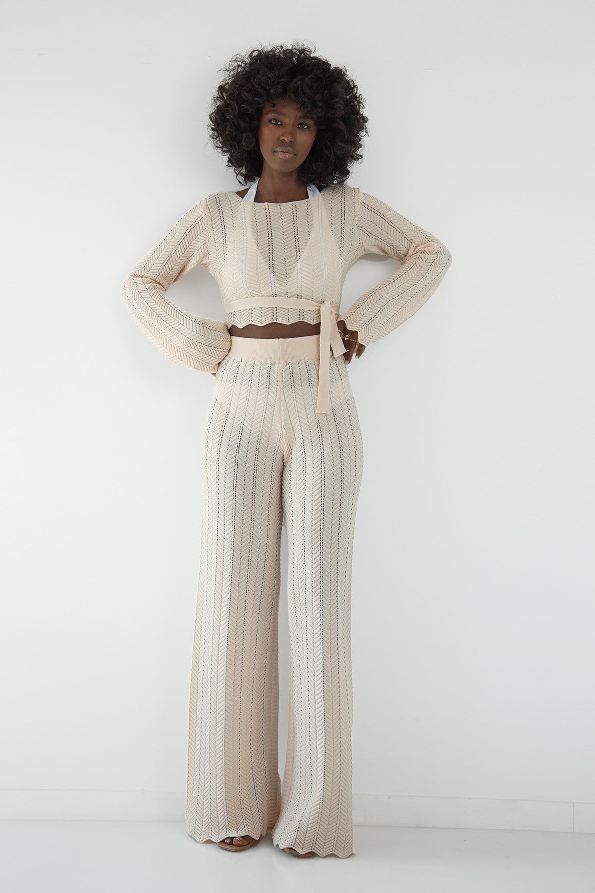 Set of long lace trousers and a beige blouse