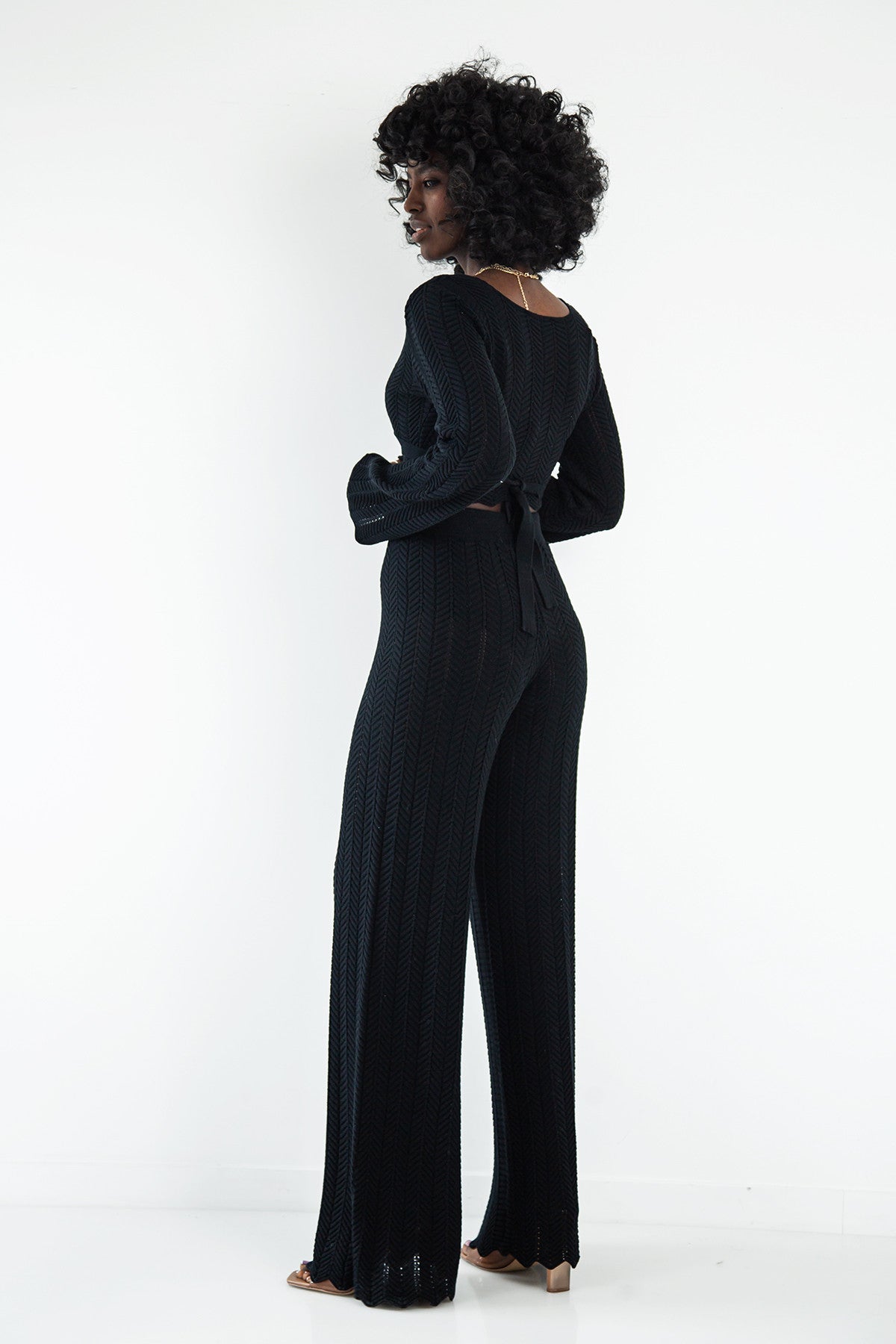 Set of long openwork trousers and a tied blouse, black