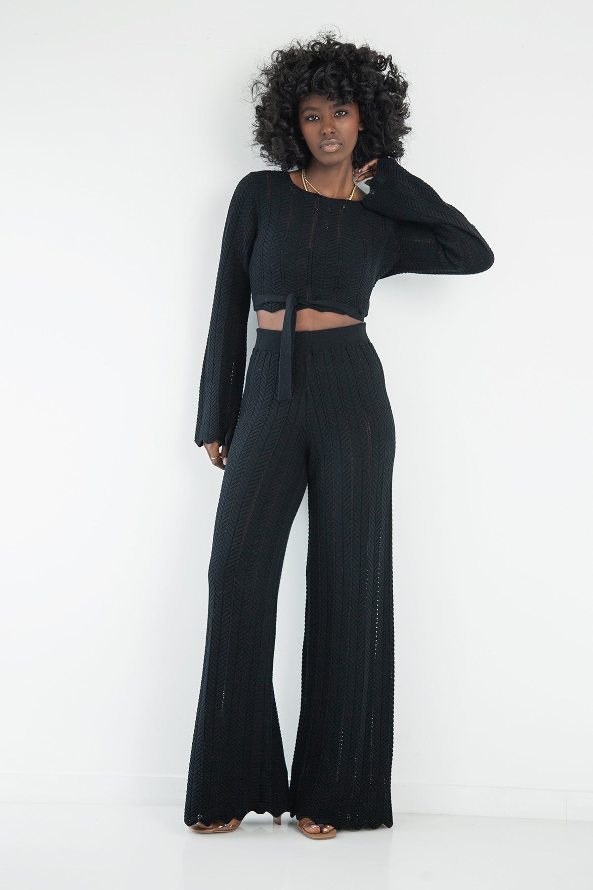 Set of long openwork trousers and a tied blouse, black