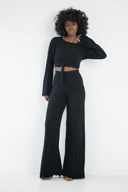 Set of long openwork trousers and a tied blouse, black