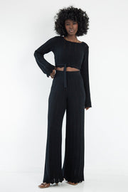 Set of long openwork trousers and a tied blouse, black
