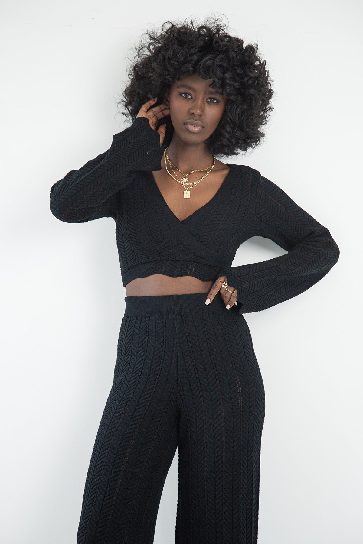 Set of long openwork trousers and a tied blouse, black