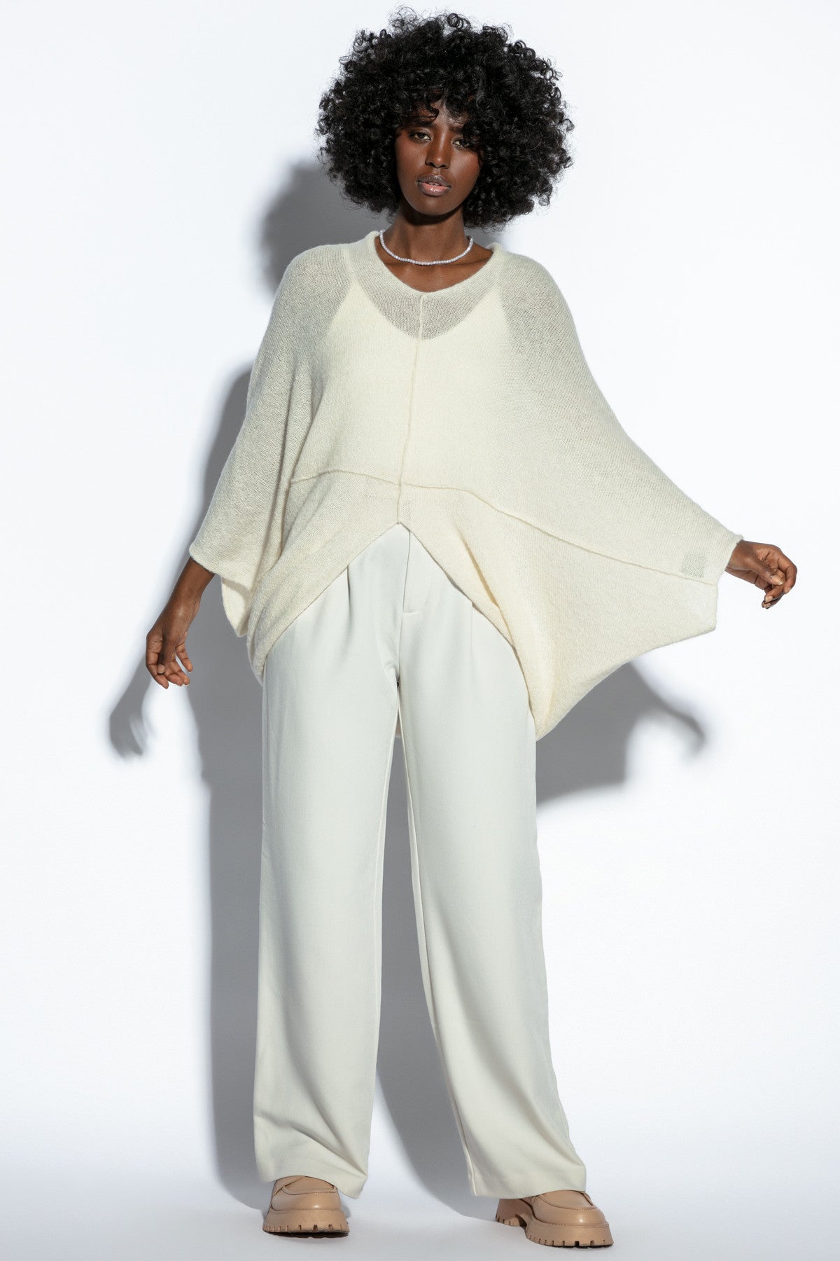 Loose, elegant ecru silk sweater overlay