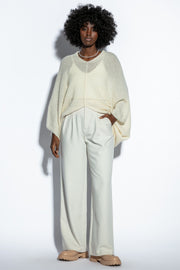 Loose, elegant ecru silk sweater overlay
