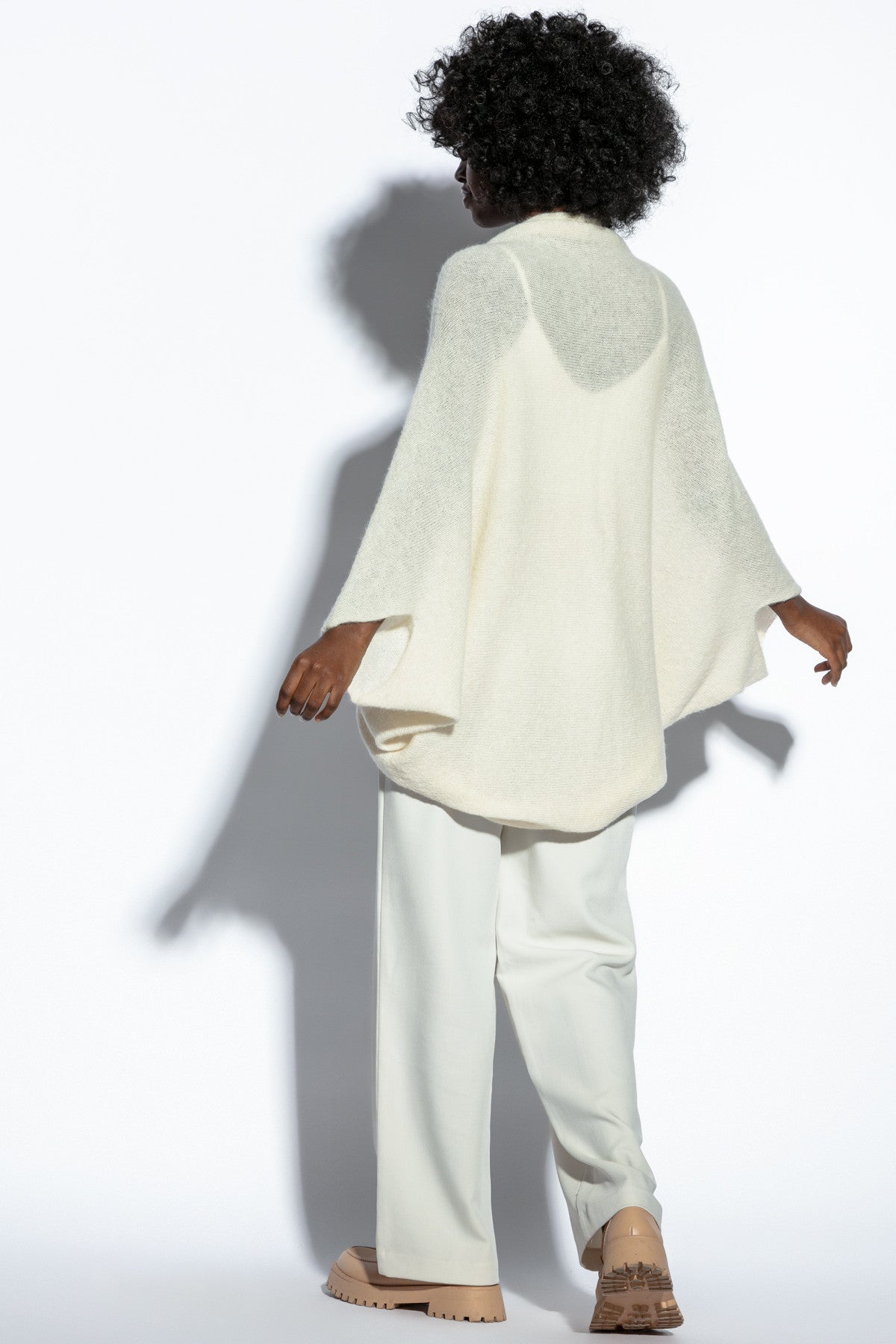 Loose, elegant ecru silk sweater overlay