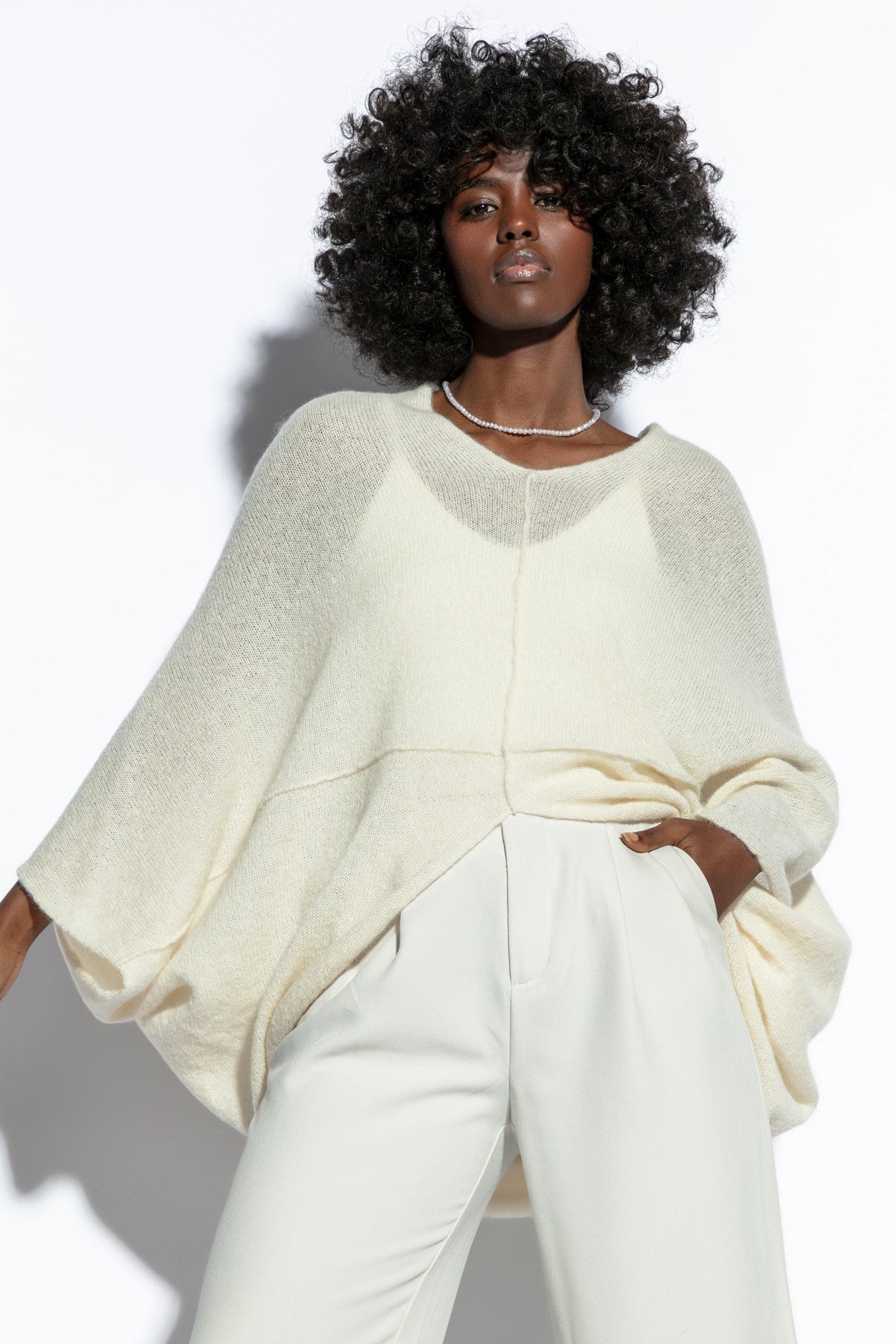 Loose, elegant ecru silk sweater overlay