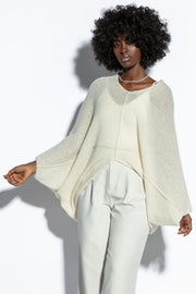 Loose, elegant ecru silk sweater overlay