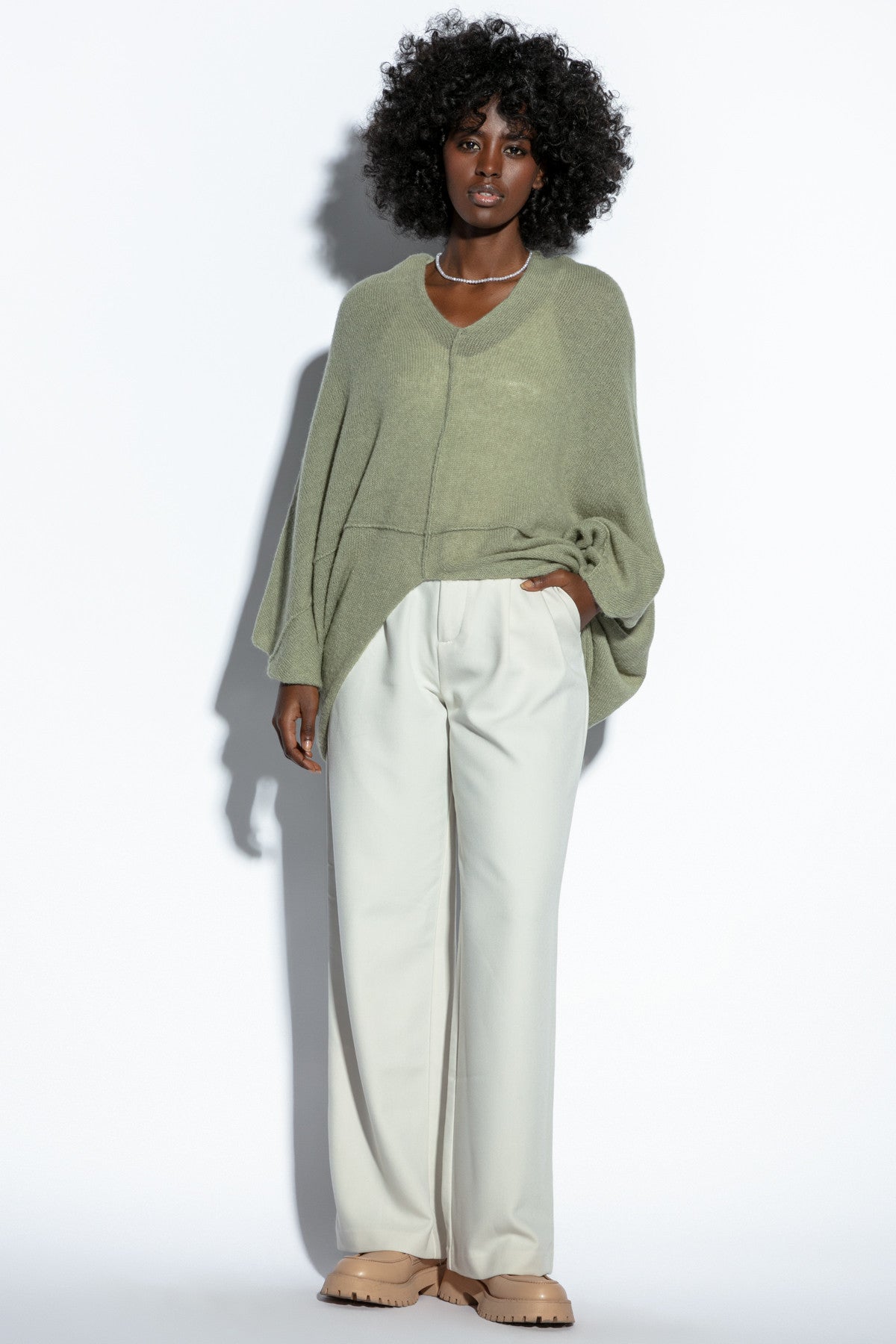Loose, elegant pistachio silk sweater cape