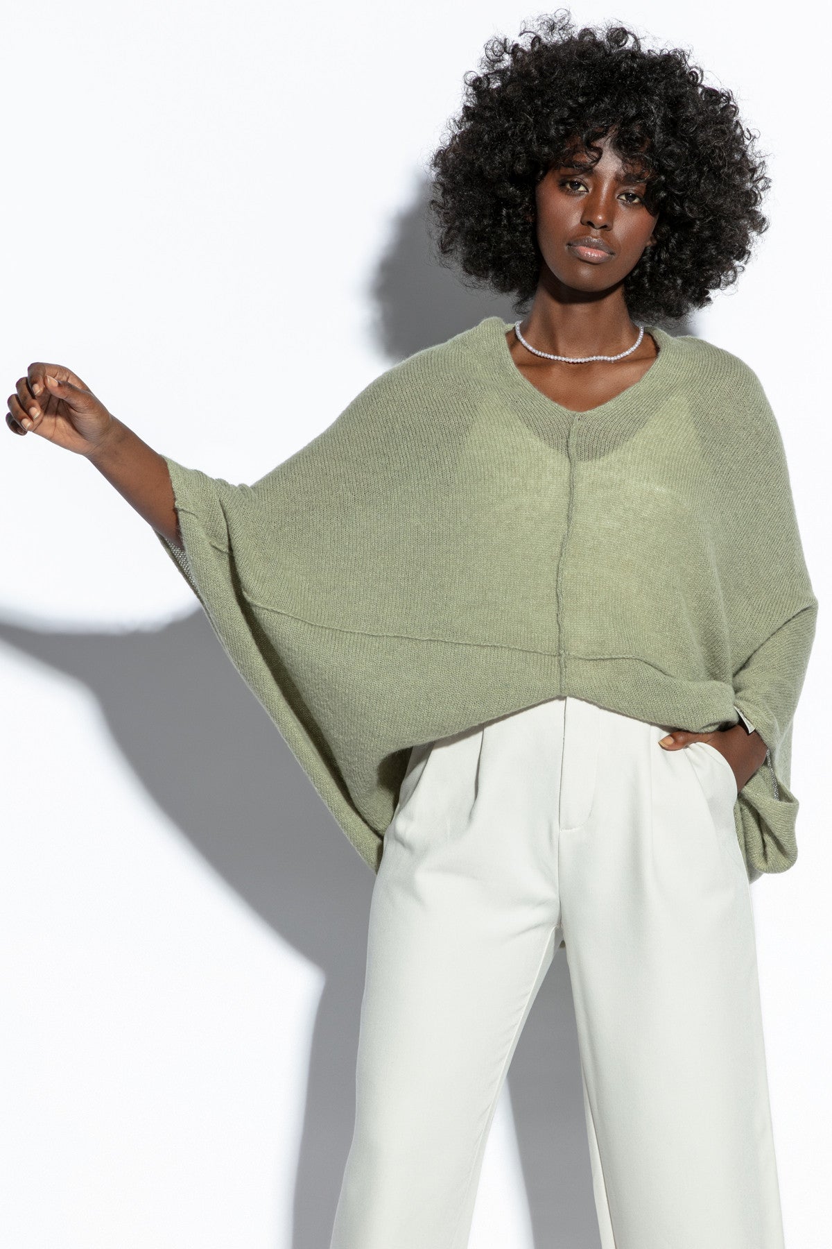 Loose, elegant pistachio silk sweater cape