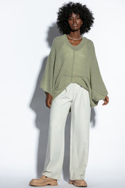 Loose, elegant pistachio silk sweater cape