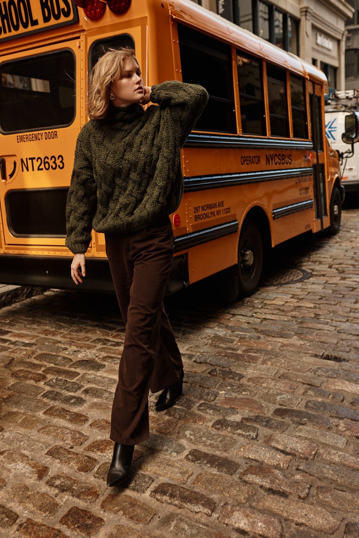 Thick woolen sweater with a cable knit, olive green