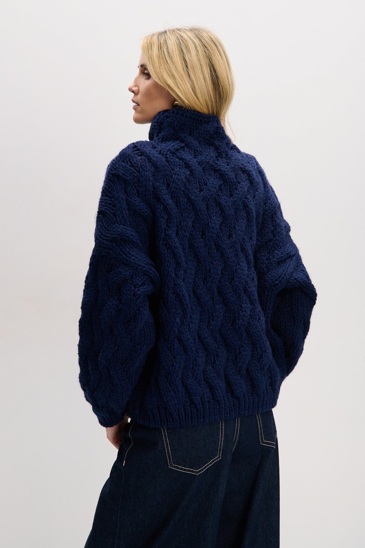 Thick woolen sweater with a cable knit, navy blue