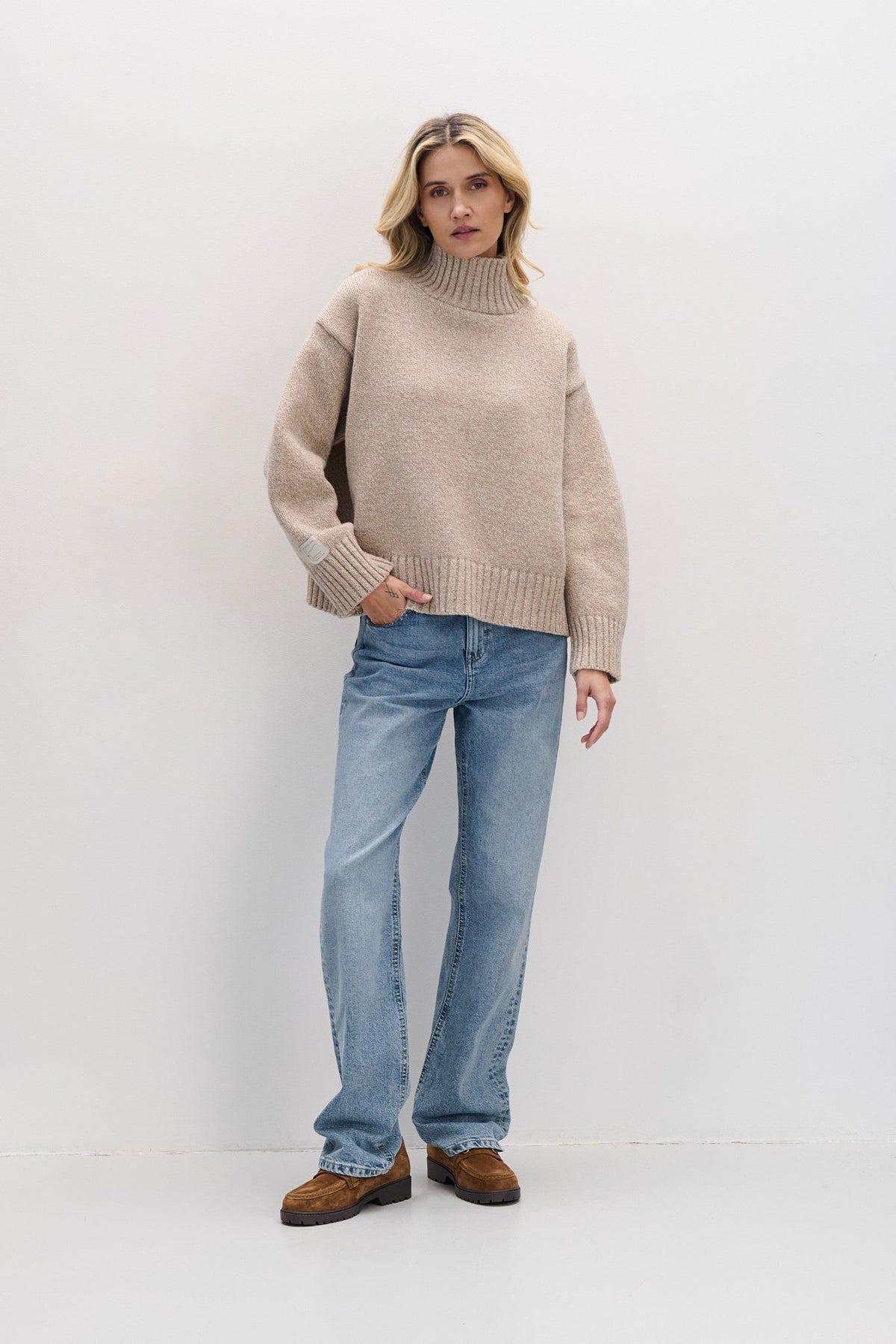 Beige chunky merino wool turtleneck sweater
