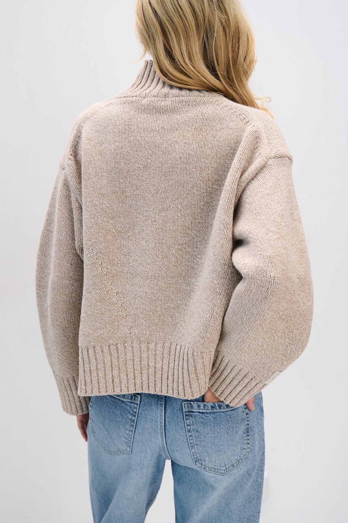 Beige chunky merino wool turtleneck sweater