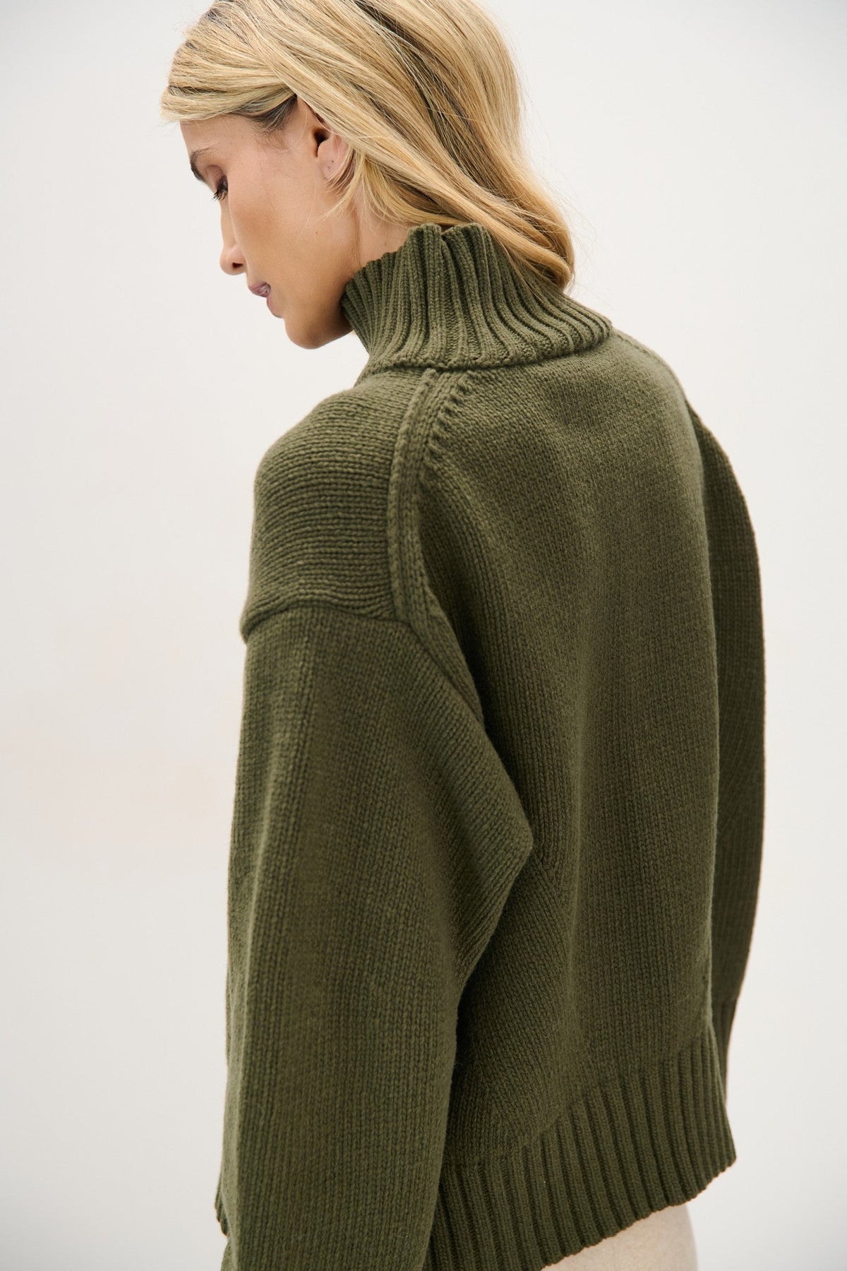 Chunky knit merino wool turtleneck sweater in olive green