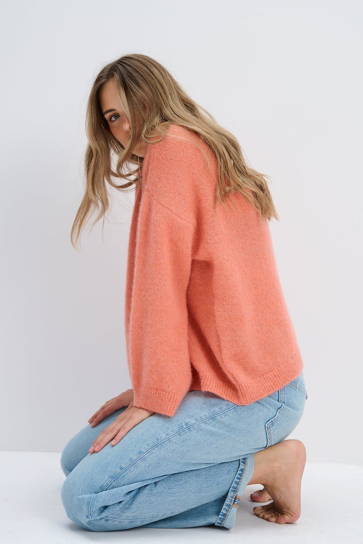 A peach alpaca wool sweater