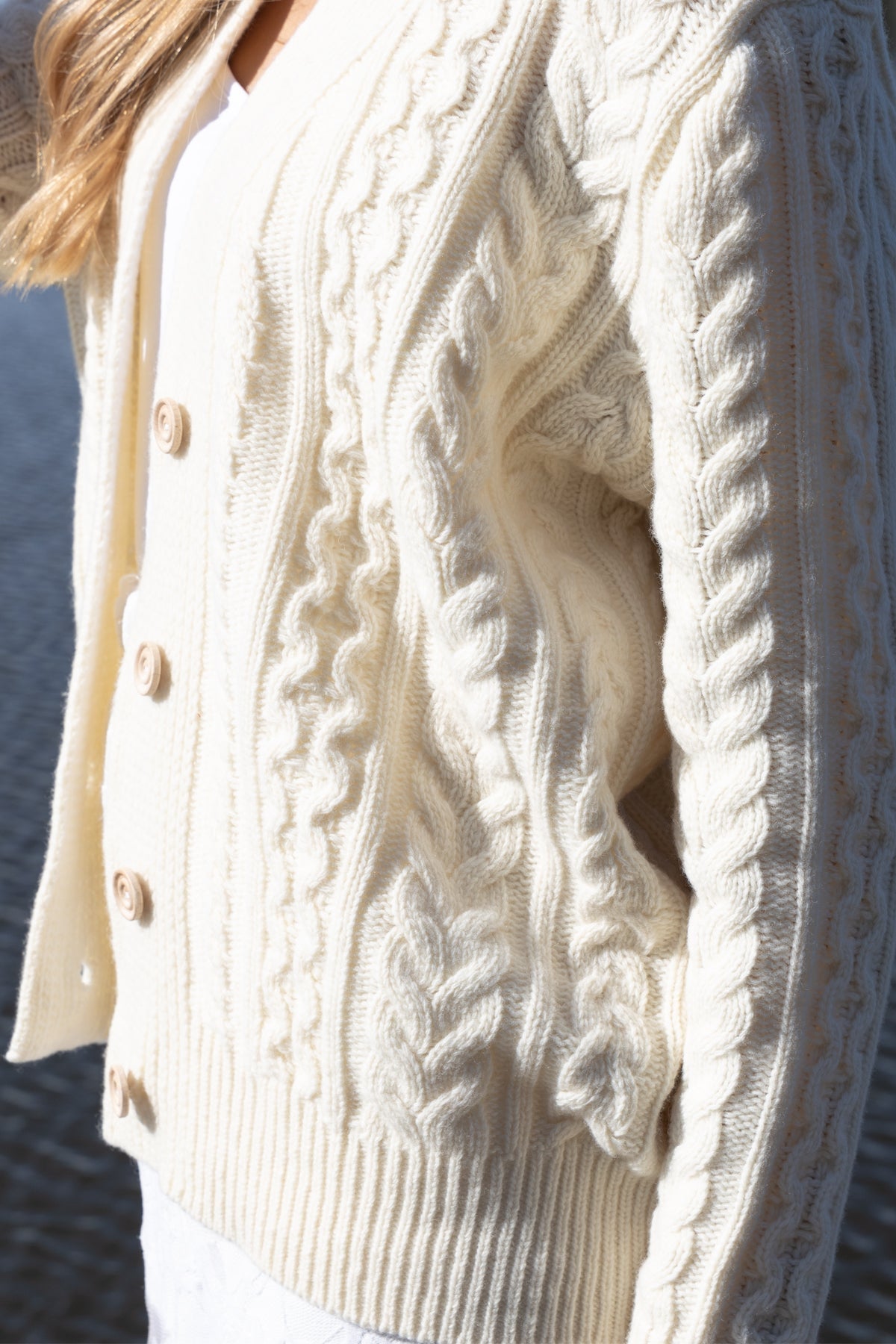 Buttoned ecru wool cardigan